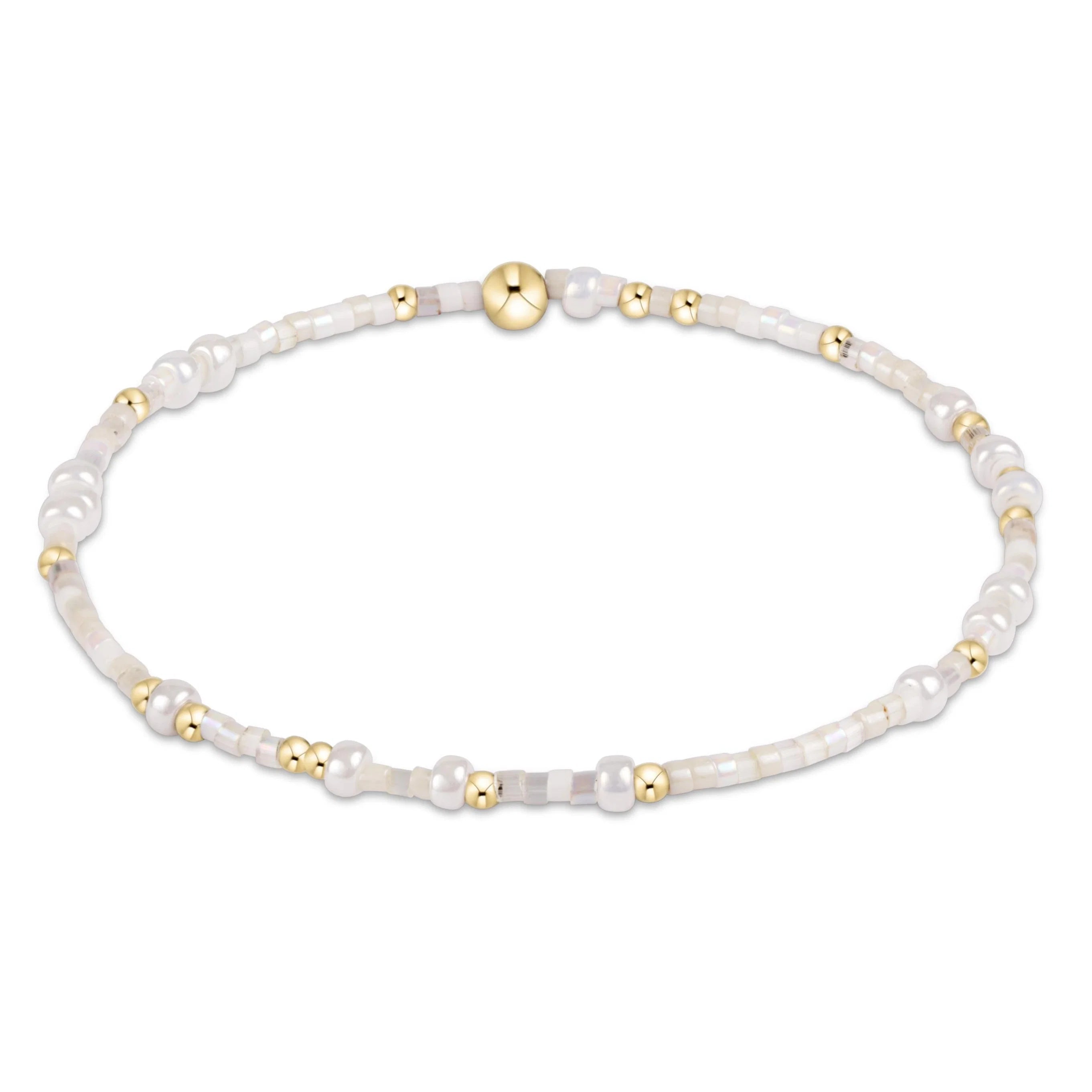 Enewton Spring Summer Hope Unwritten bracelet with silver chain and charm, styled on a white background.