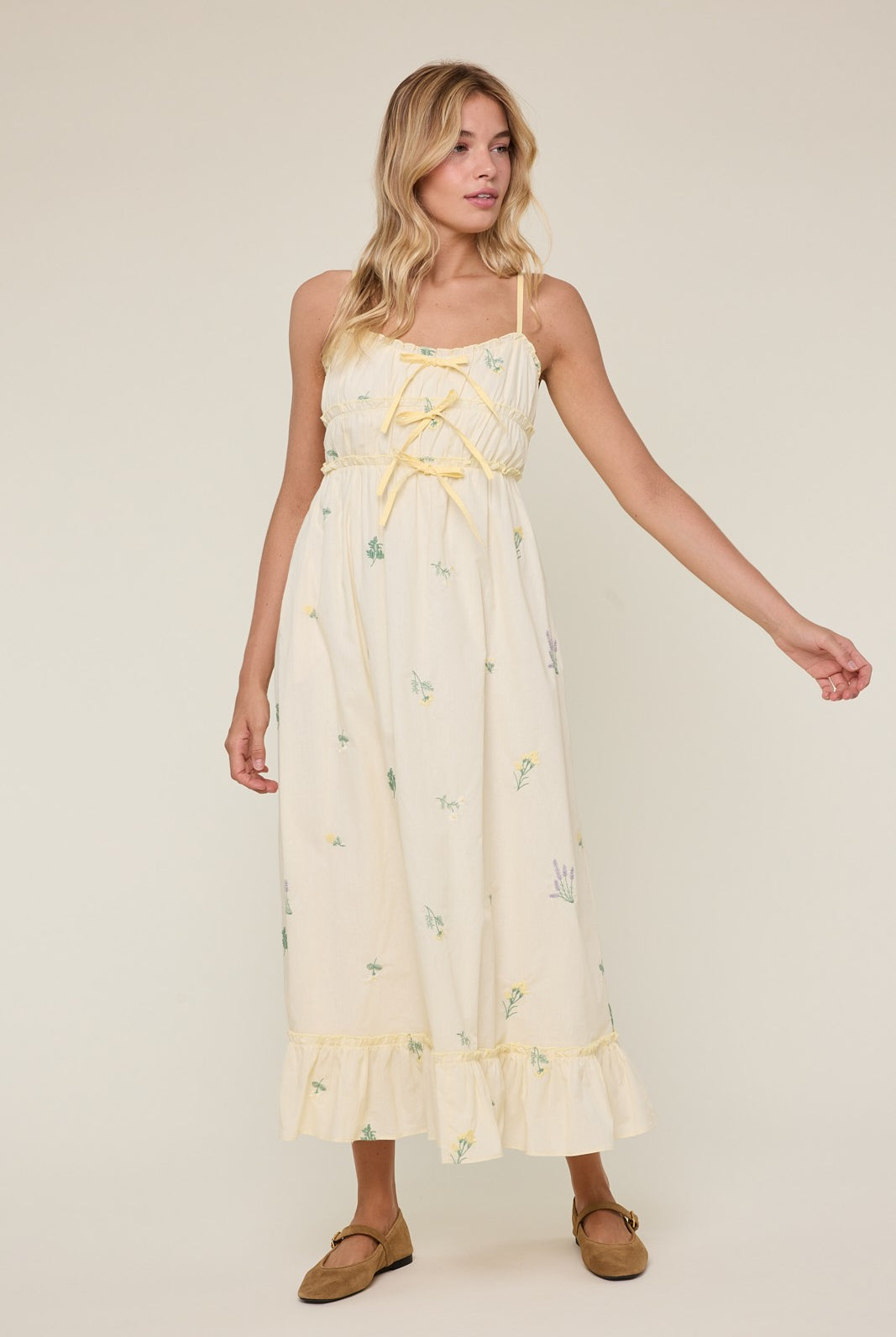 Avery Triple Bow Floral Midi Dress by WISHLIST featuring a flowy fabric, floral print, and elegant bow details.