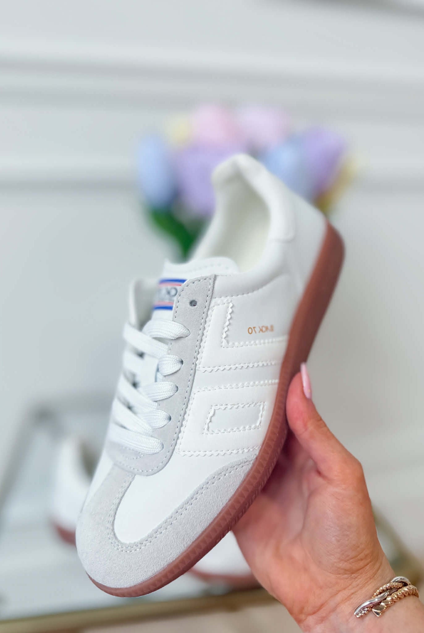 White Ice BACK70 Cloud Sneakers, 205 model, showcasing sleek design and comfortable fit in a close-up view.