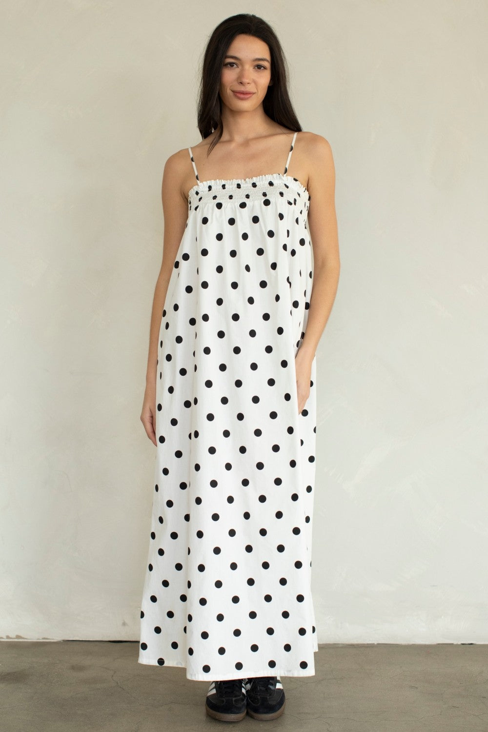 Laney Polka Dot Maxi Dress by THINGS BETWEEN featuring a flowy silhouette and classic polka dot pattern in a dressy style.