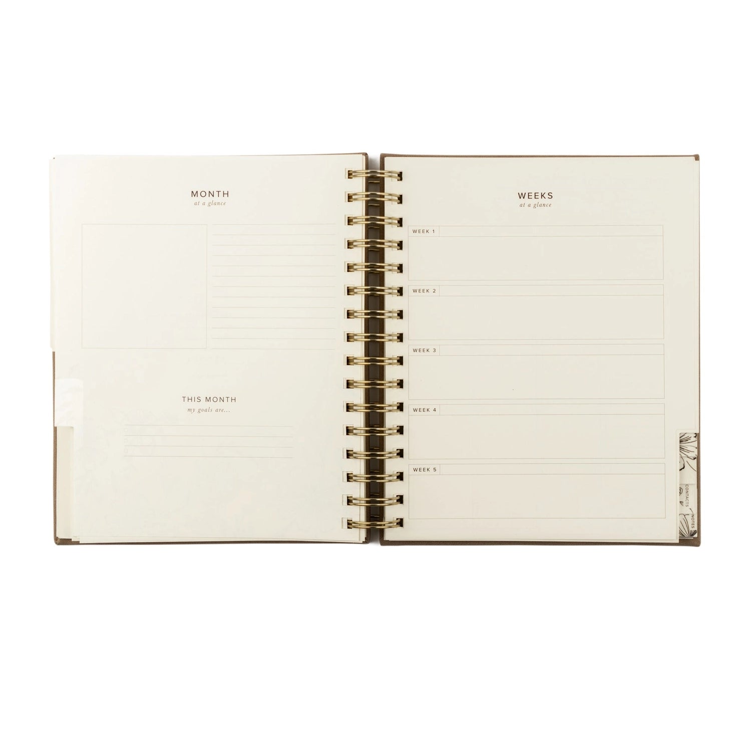 Undated 12-month planner by HOSANNA REVIVAL with a minimalist cover design, ideal for organizing schedules and appointments.