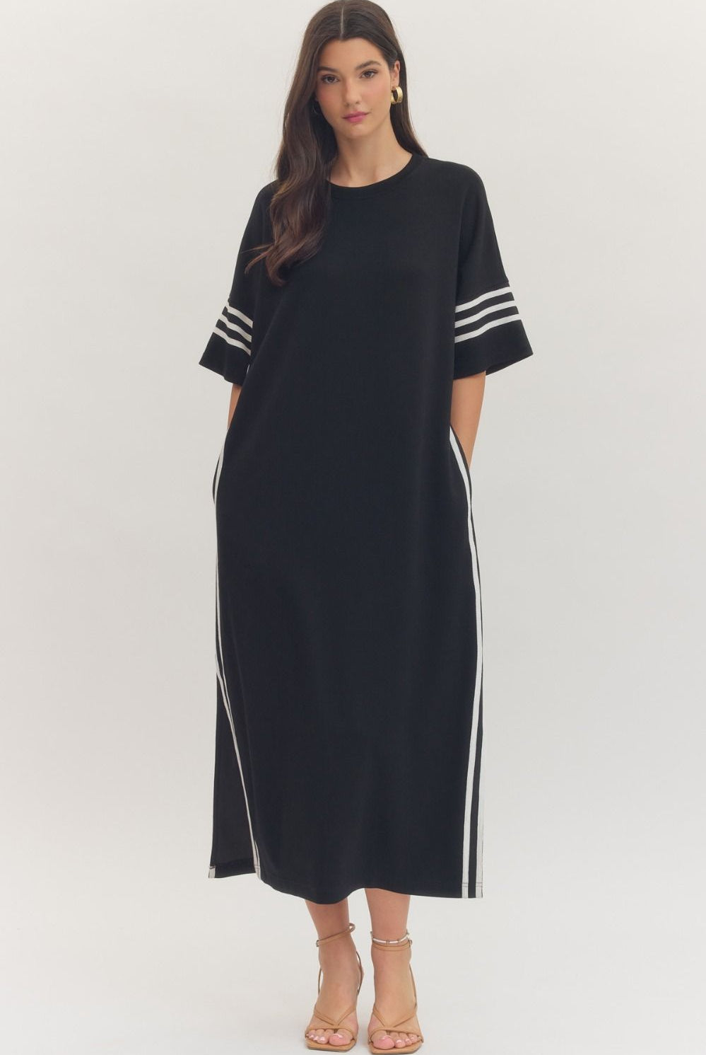 Black and white striped ENTRO Junie midi dress with contrasting sleeve details, stylish casual dress for everyday wear.