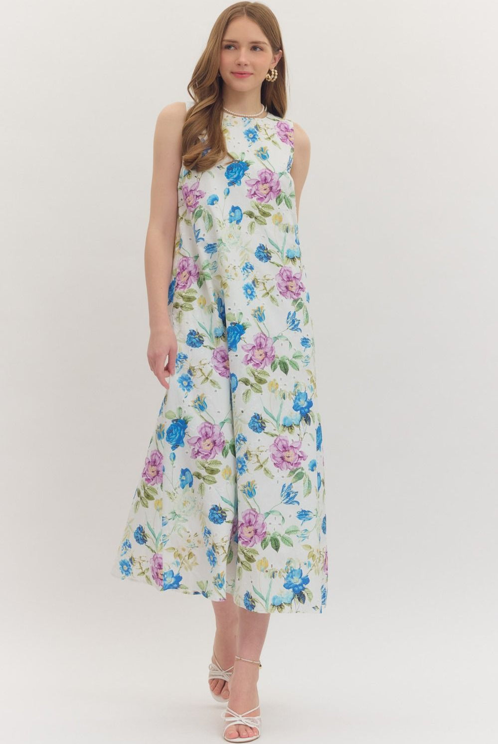 Blue botanical floral midi dress by ENTRO featuring a flowy design and elegant floral pattern, perfect for dressy occasions.