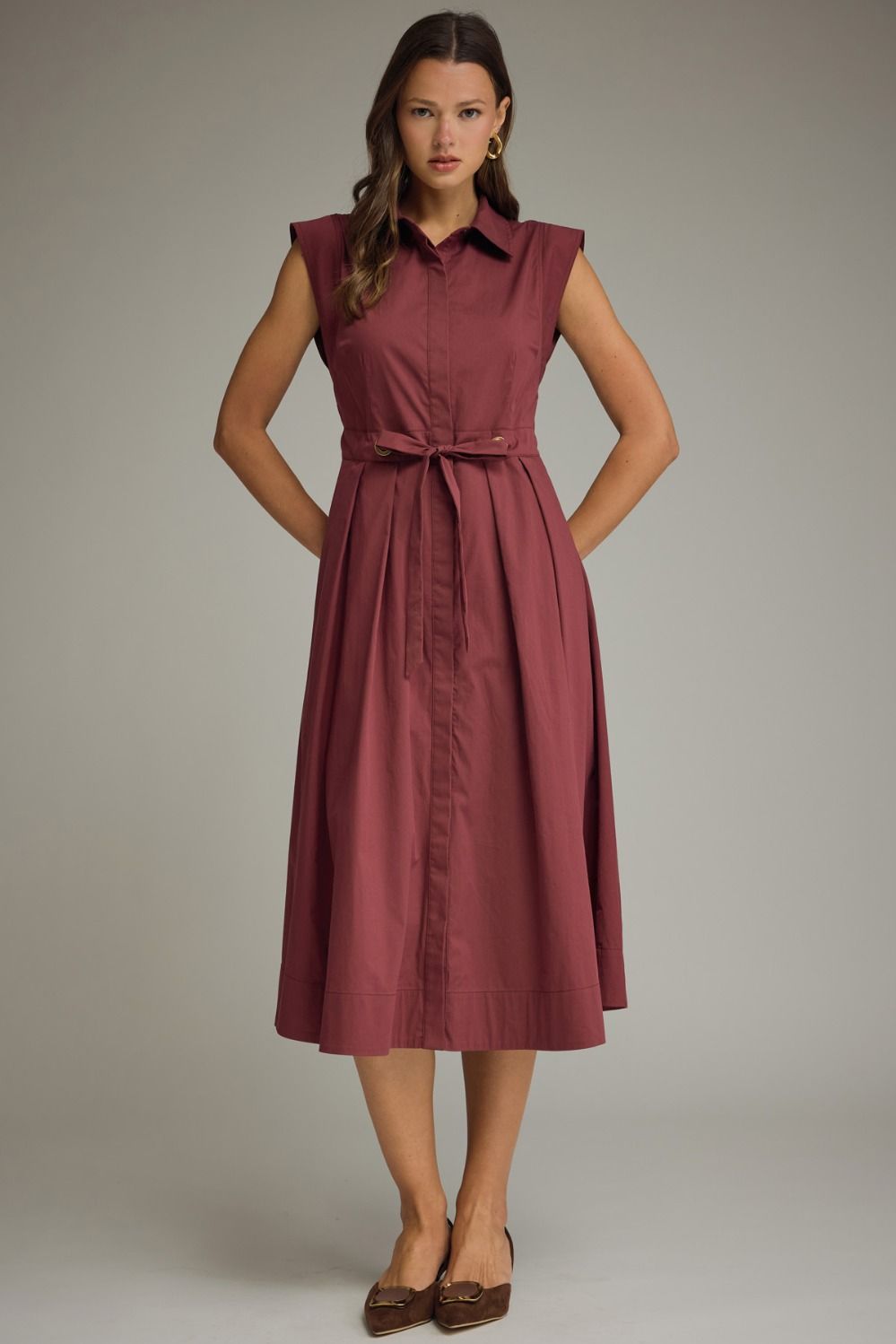 Sandra tie waist sleeveless midi dress by ENTRO, featuring a stylish design with a flattering fit and elegant midi length.