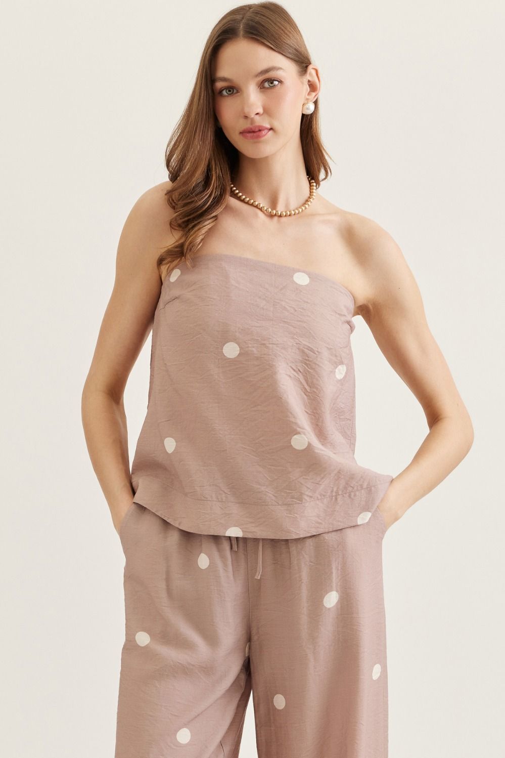 ENTRO Kyle polka dot strapless casual top with ruffled neckline, lightweight fabric, and playful pattern, perfect for summer wear.