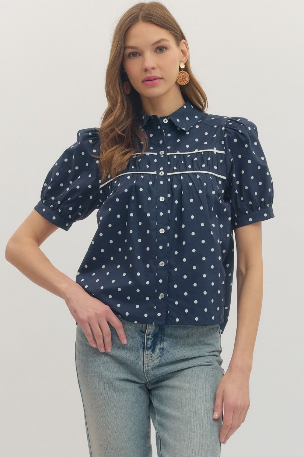 Navy polka dot blouse top by ENTRO, a stylish dressy top with a flowy fit and long sleeves, perfect for casual or semi-formal wear.