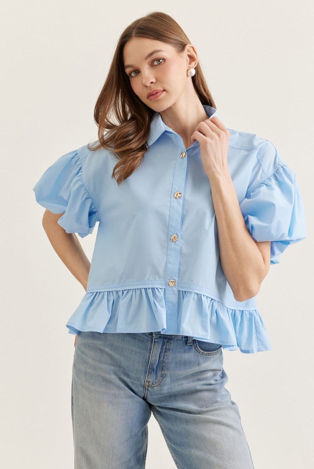 Light blue Maggie ruffle hem casual top by ENTRO, featuring a feminine design and soft fabric, perfect for everyday wear.