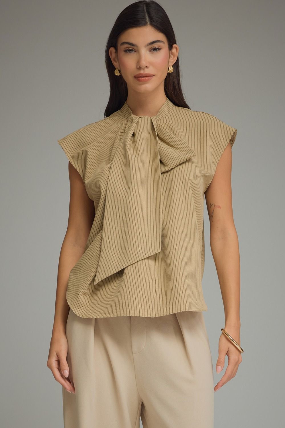 Striped Junie cap sleeve top by ENTRO, a stylish dressy top with a fitted design, perfect for casual or semi-formal occasions.