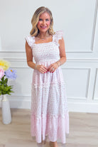 Peach Love Monica floral mixed pattern dress with long sleeves and ruffled hem, elegant and suitable for dressy occasions.