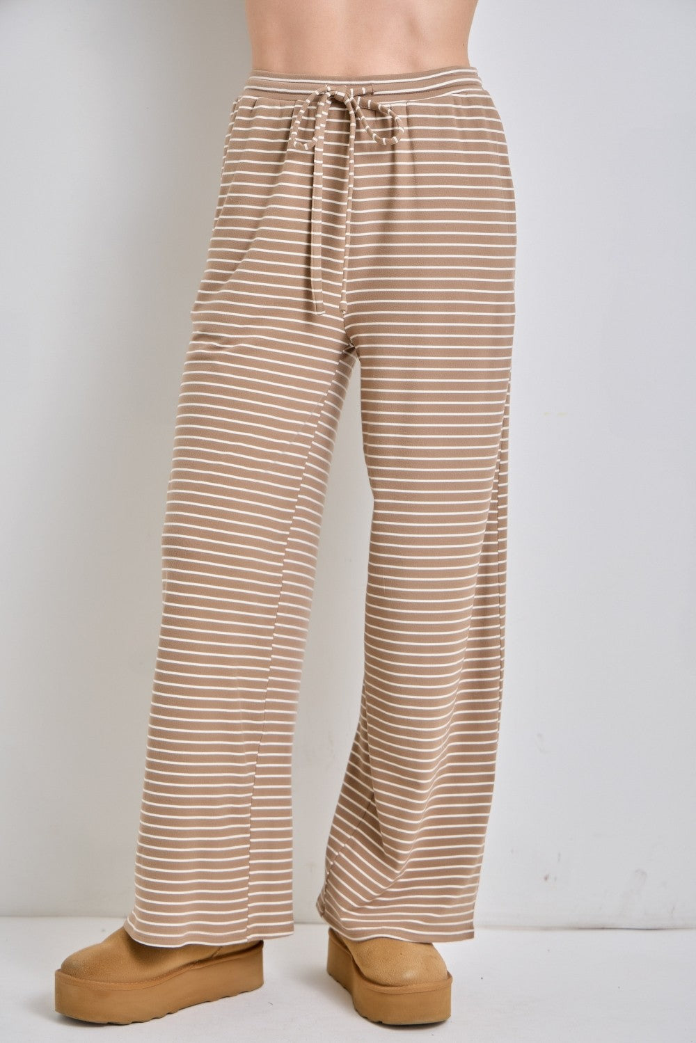 Baevely Megan striped drawstring wide leg pants in black and white, featuring a relaxed fit and high waist.