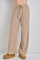 Baevely Megan striped drawstring wide leg pants in black and white, featuring a relaxed fit and high waist.