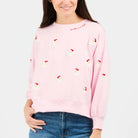 Pink Santa graphic sweatshirt from Mary Square's Millie collection, featuring festive holiday design and cozy pullover style.