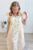 Aubrey yellow floral flutter sleeve dress by ENTRO, featuring a flowy silhouette and vibrant floral pattern, perfect for dressy occasions.