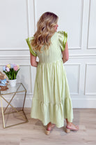 Lacy flutter sleeve solid trim dress by ENTRO, featuring elegant lace details and a flattering fit for dressy occasions.