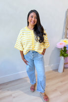 Lauren yellow striped button-down cardigan top from BAEVELY, featuring a spring-inspired sweater with vibrant yellow and white stripes.