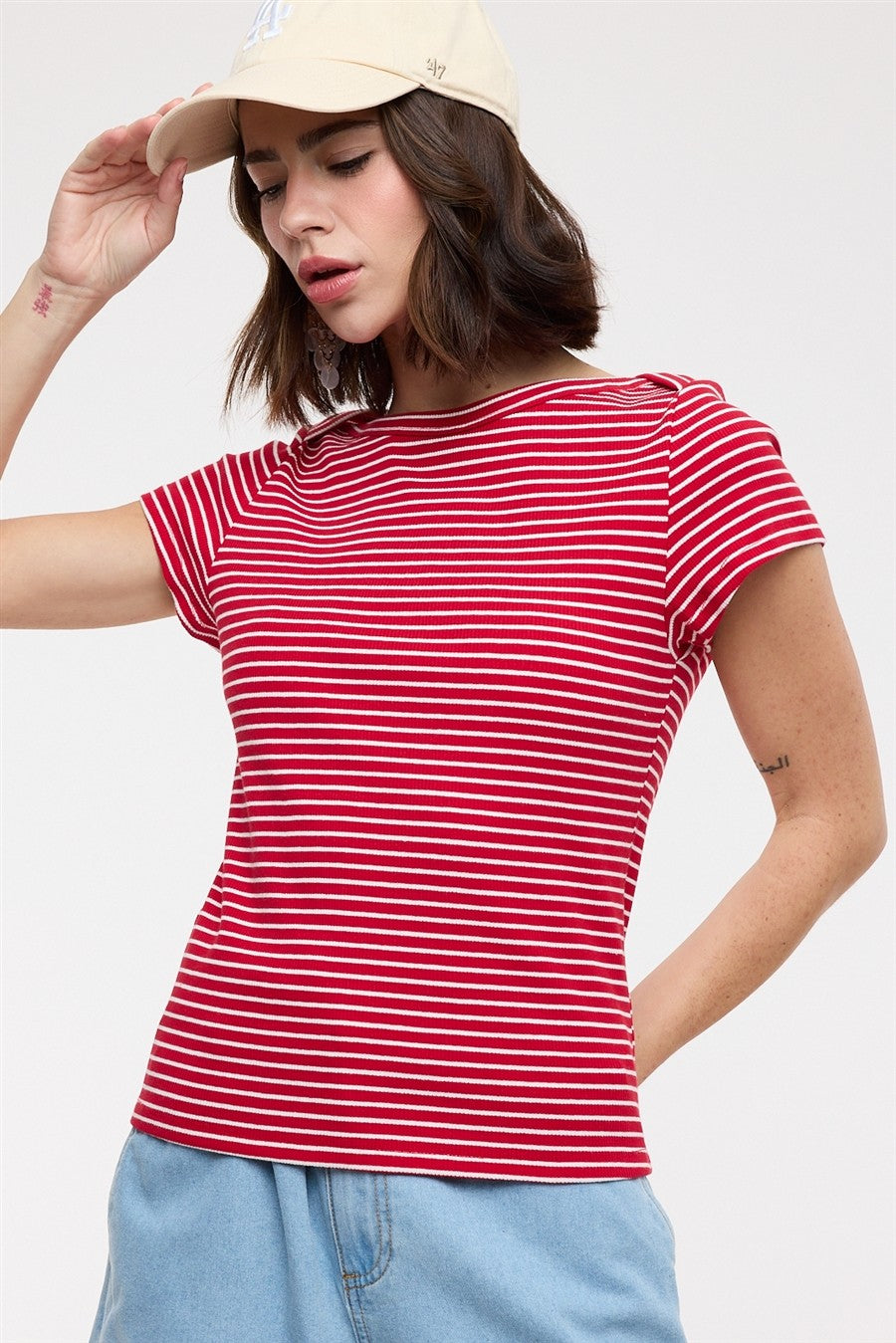 WISHLIST Jimmy striped boat neck casual top, featuring a classic striped pattern and boat neckline, displayed on a hanger.