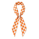 Orange checkered game day scarf necklace with QUEENS DESIGNS branding, featuring a stylish accessory for sports fans.