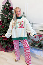 Reversible green striped sweatshirt from PEACH LOVE's 137 Graphic Sweatshirts collection, featuring festive holiday design.