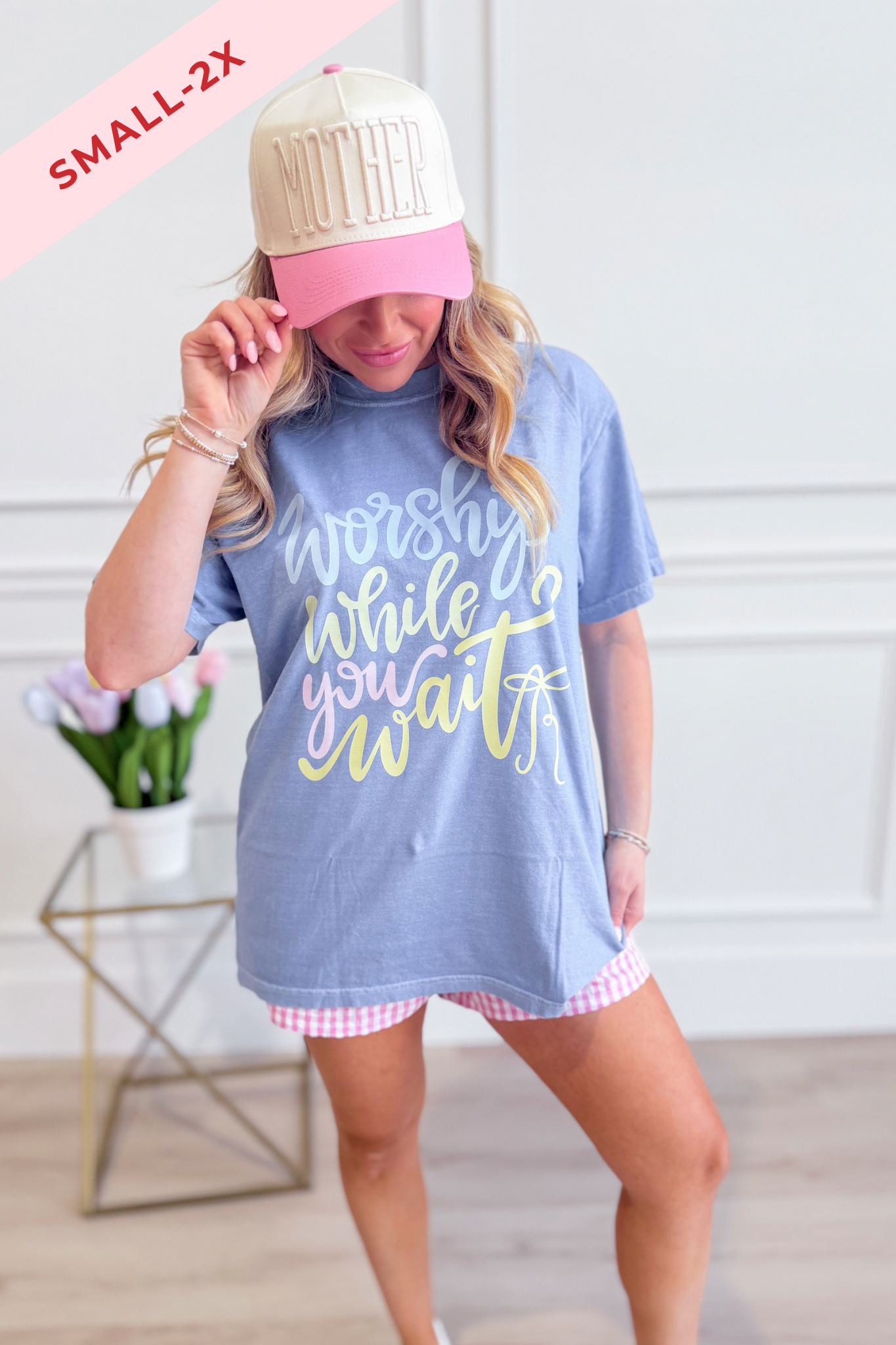 DASH FORWARD Worship While You Wait Graphic T-Shirt featuring a bold design on a casual crewneck tee.