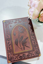 HOSANNA REVIVAL ESV Palma Theme Journaling Bible with decorative cover and open pages for note-taking and reflection.