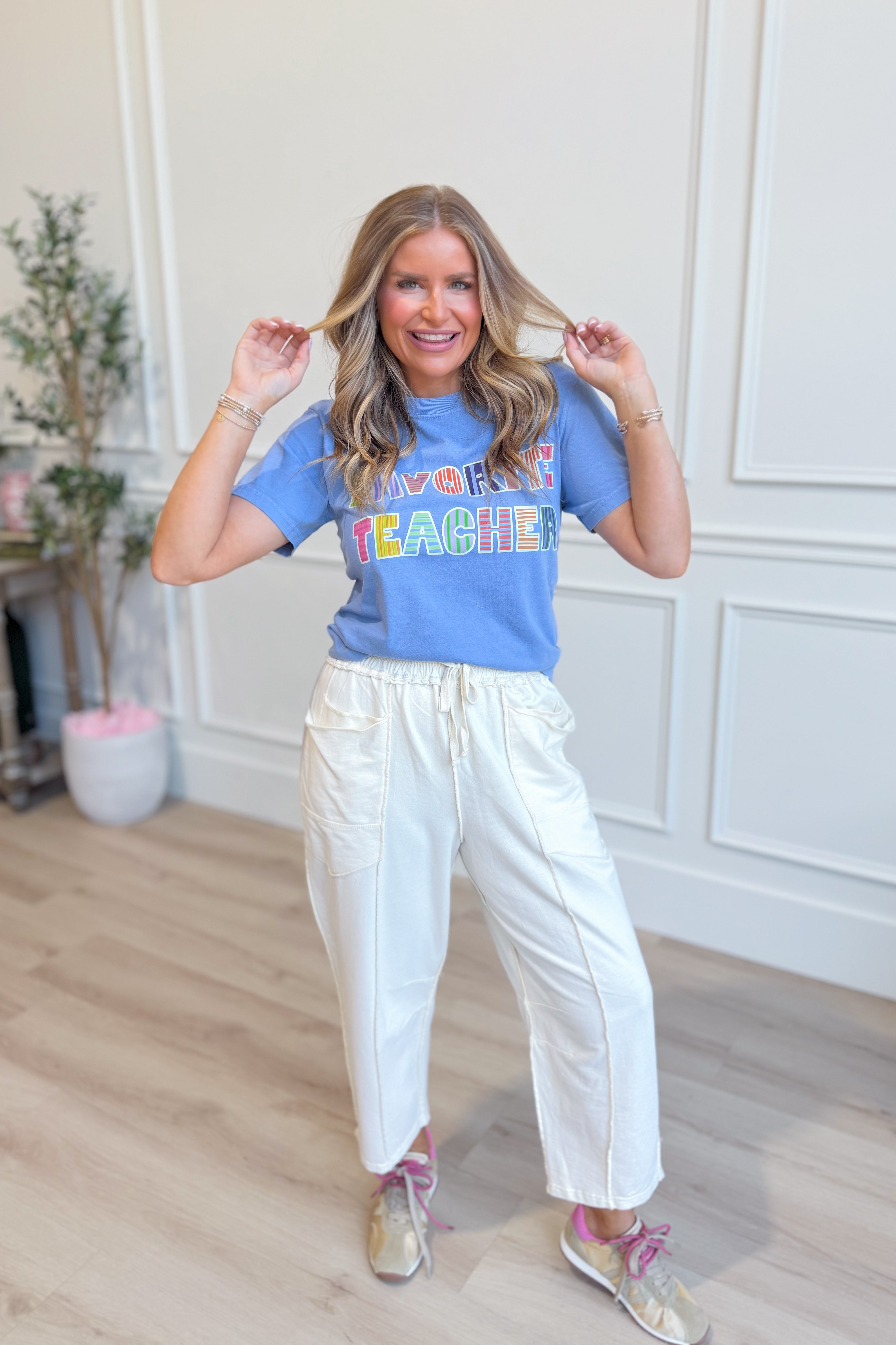 Favorite Teacher graphic T-shirt by ETTA & EAST featuring a colorful teacher-themed design on a casual tee.