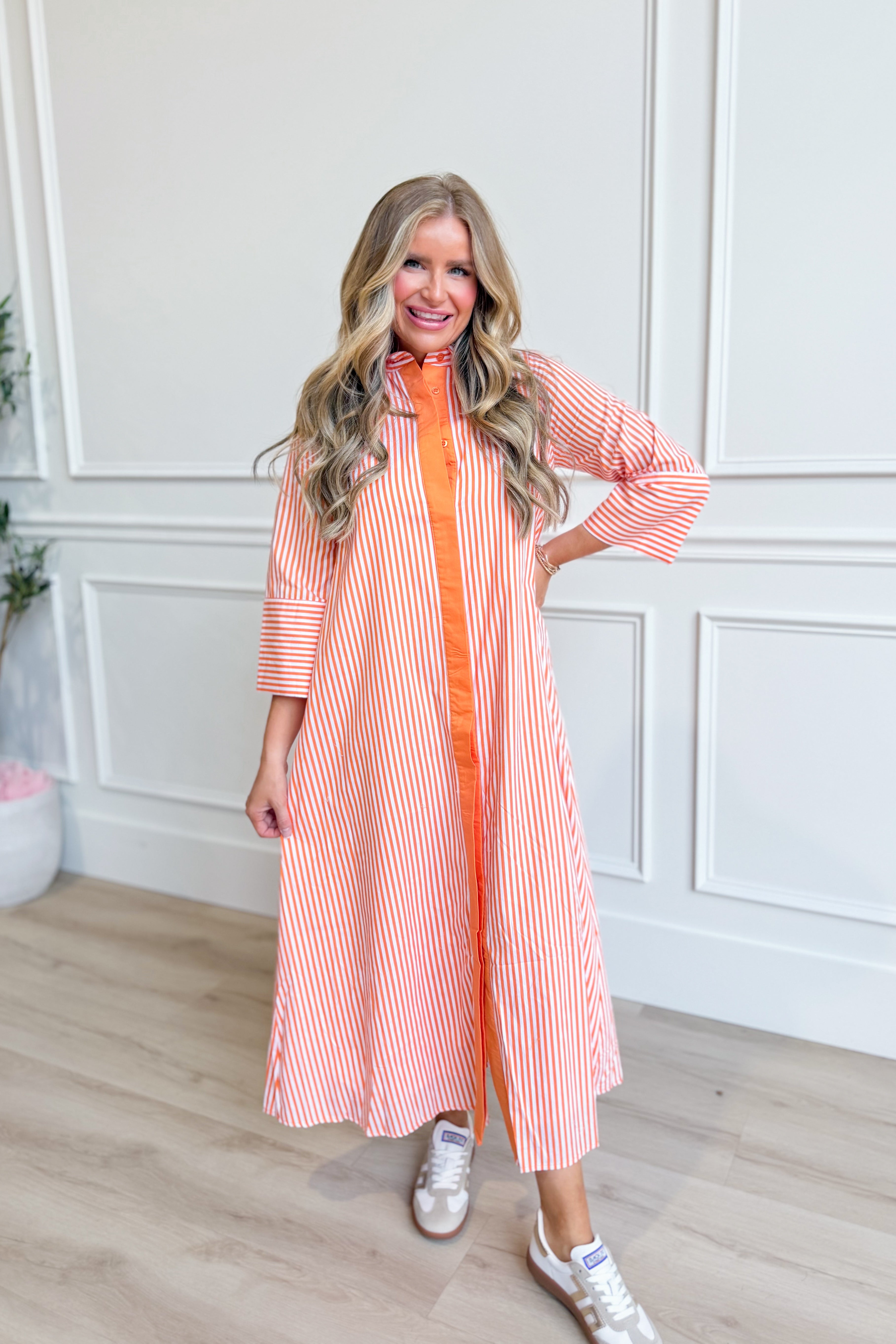TCEC Aly striped button-down midi dress with long sleeves and fitted waist, featuring a stylish midi length and classic stripe pattern.