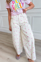 Pink polka dot barrel jeans by PEACH LOVE, 147 novelty jeans style, with a relaxed fit and vintage-inspired design.