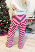 Rudy Red Striped Holiday Pants from BUCKET LIST, 156 Pants style, featuring festive red and white stripes, casual holiday wear