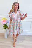 UMGEE USA Larry floral flutter sleeve dress featuring a flowy silhouette and vibrant floral pattern, perfect for dressy occasions.