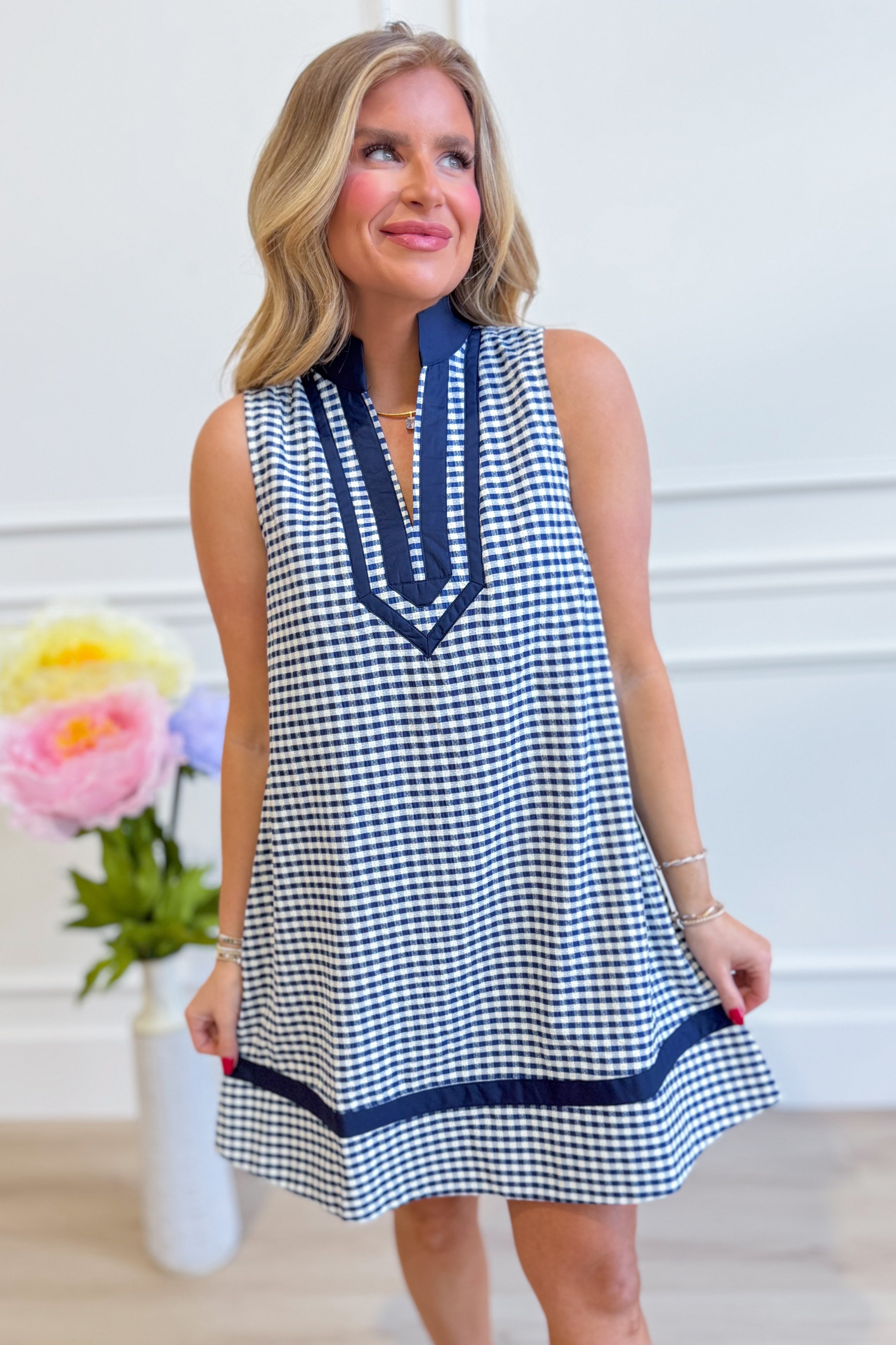 Corinne plaid sleeveless dress by ENTRO featuring a stylish plaid pattern, fitted bodice, and flowy skirt for dressy occasions.