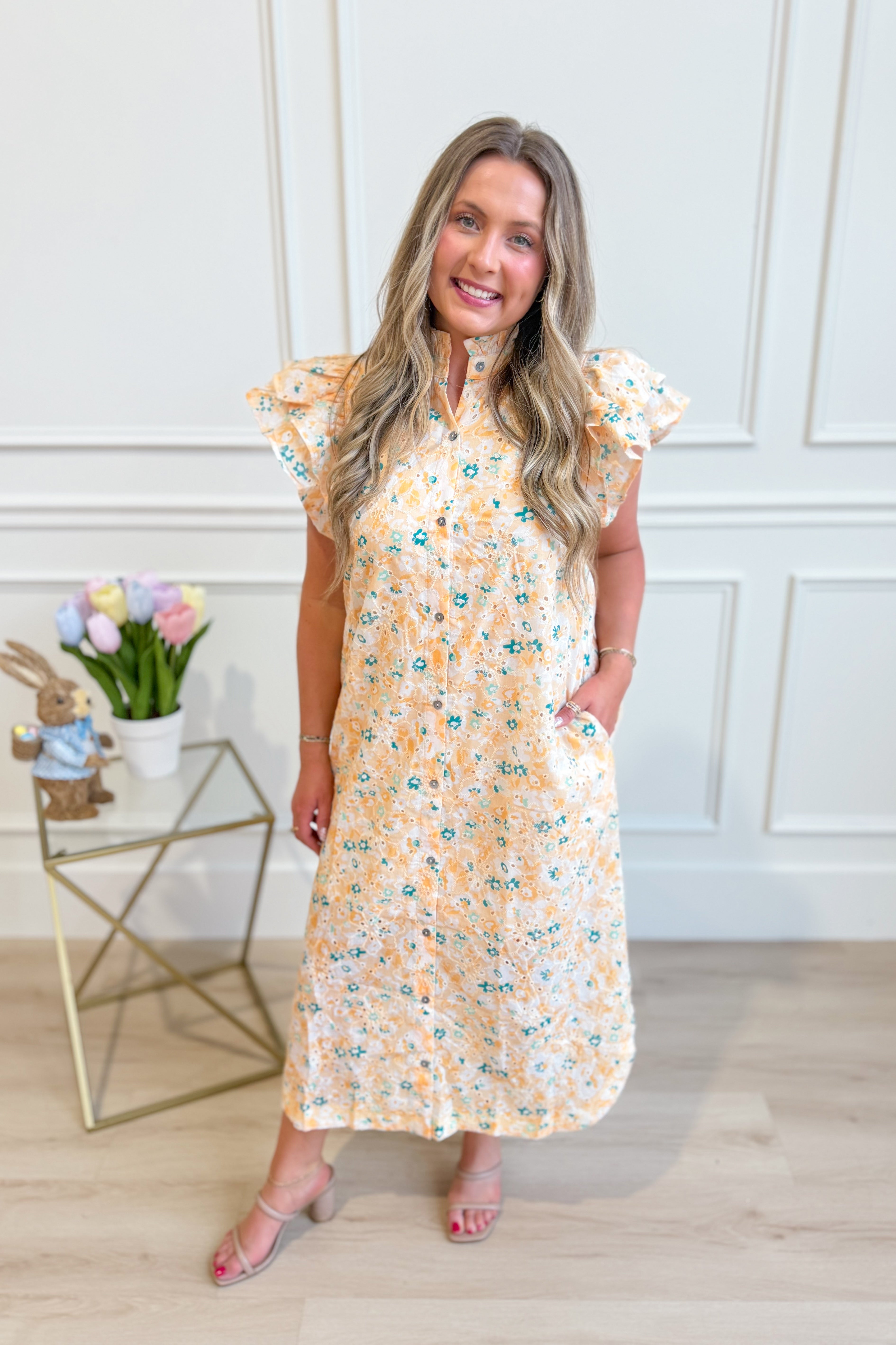 Aubrey Yellow Floral Flutter Sleeve Dress by ENTRO, featuring a flowy floral design and flutter sleeves, perfect for dressy occasions.