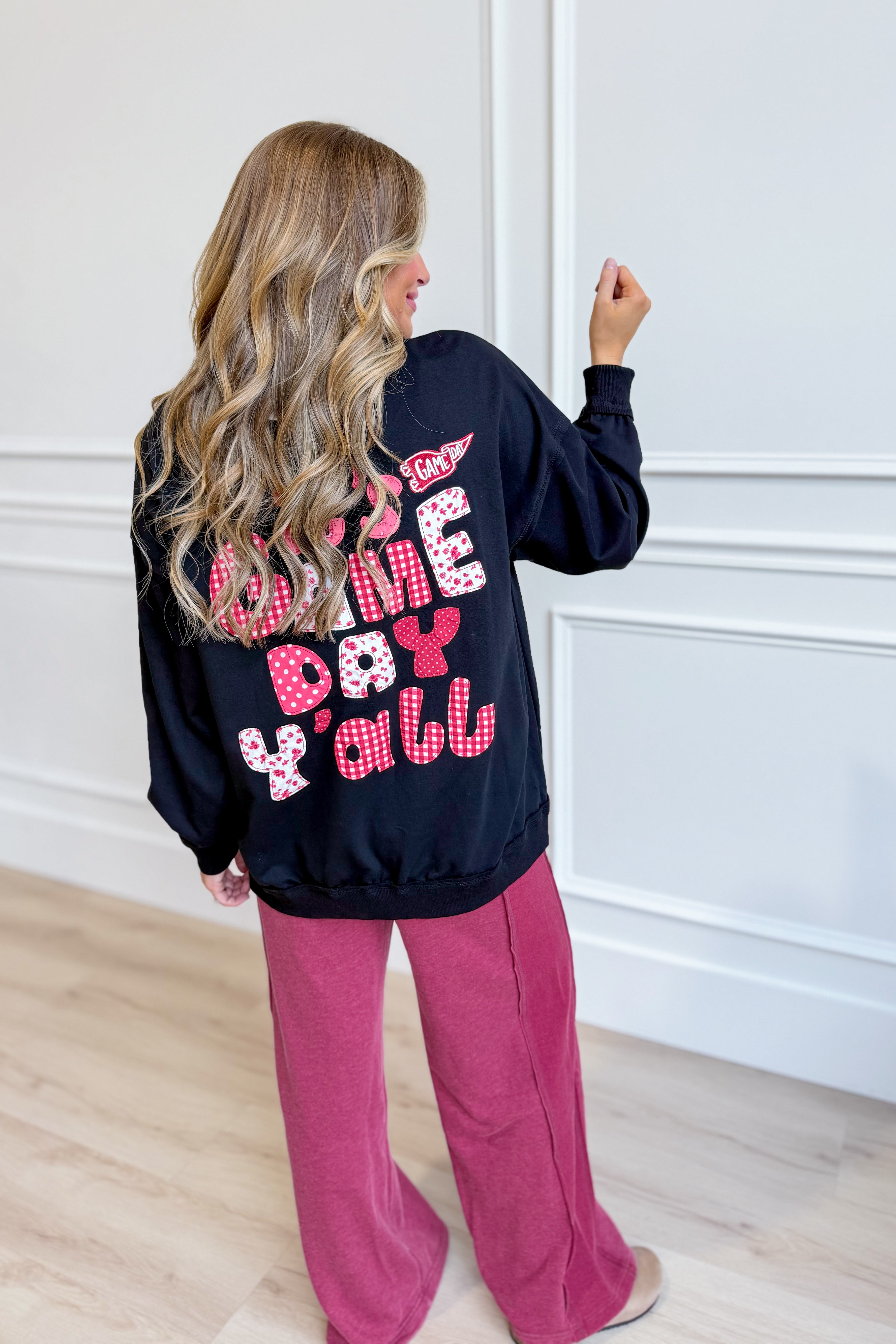 PEACH LOVE Cynthia Black Game Day Pullover with 137 graphic sweatshirt design, featuring bold game day graphics on a black sweatshirt.