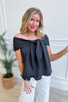 TCEC Oneita bow accented off-the-shoulder dressy top in black with elegant bow detail and long sleeves.