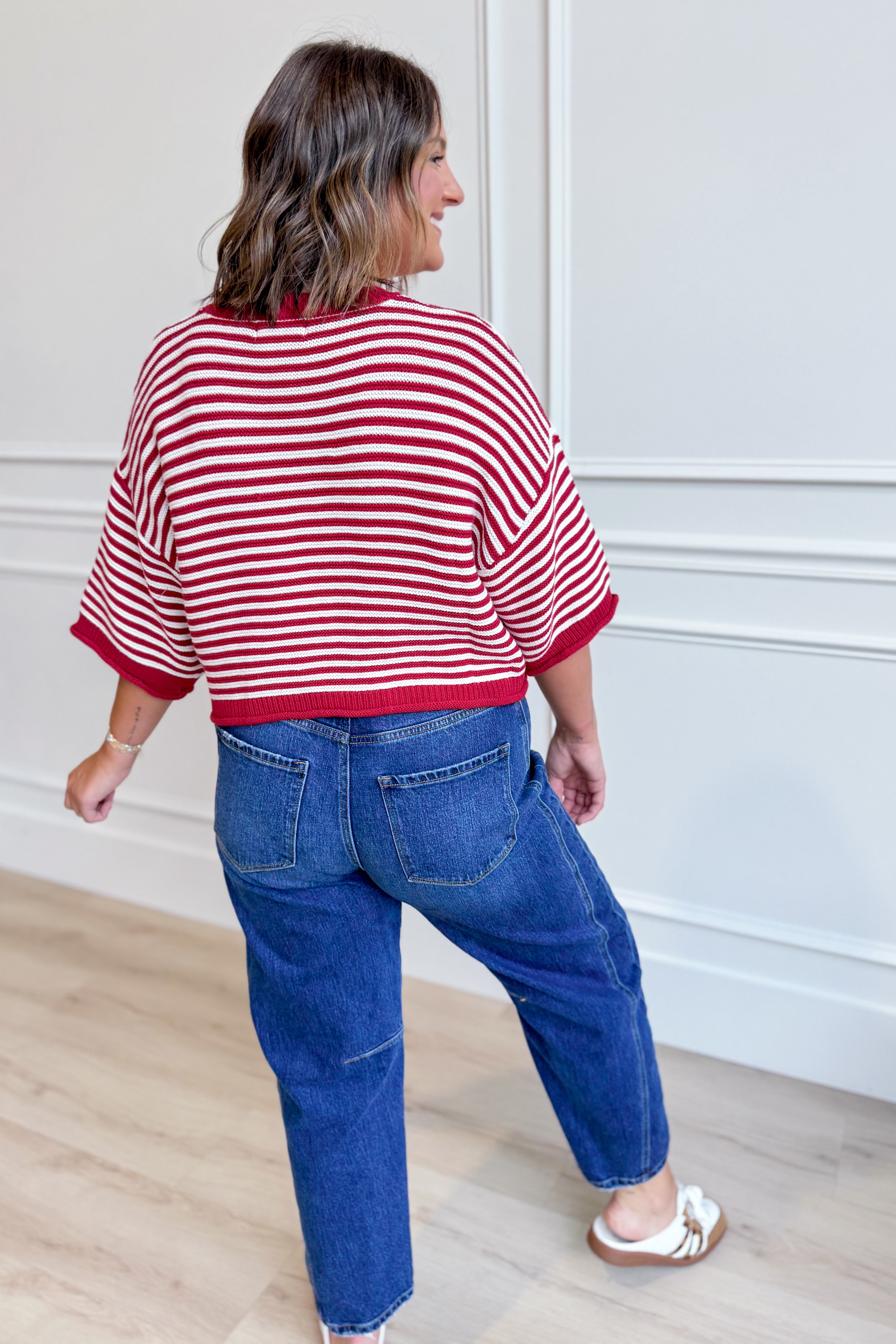 Red striped oversized sweater top by PEACH LOVE, featuring half sleeves and a relaxed fit, perfect for fall styling.