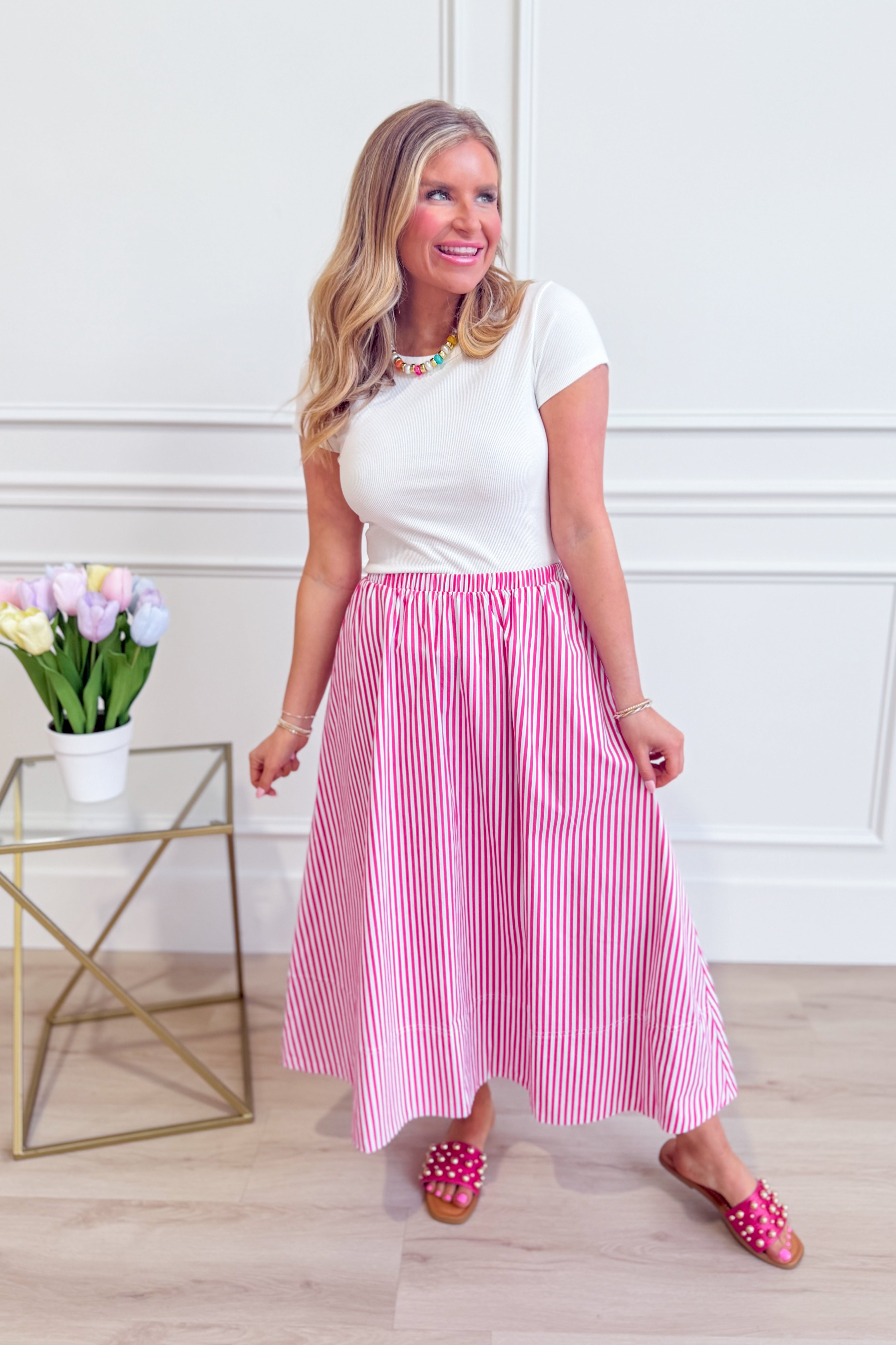 HYFVE Tammy pin-striped midi skirt with a high waist and flowing silhouette, featuring vertical navy and white stripes.