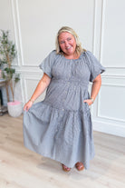 Tyler Gingham Printed Smocked Waist Dress by BAEVELY, showcasing a stylish gingham pattern and fitted smocked waist on a dressy dress.