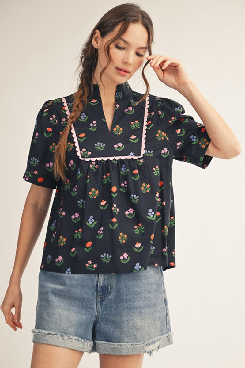 Jodifl Lonny floral printed top with long sleeves and v-neck, featuring a colorful floral pattern on lightweight fabric.