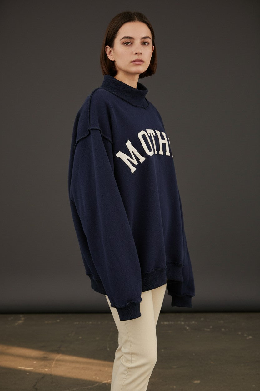 Mother Navy mock neck embroidered sweatshirt from BUCKET LIST, featuring a graphic design and cozy fit.