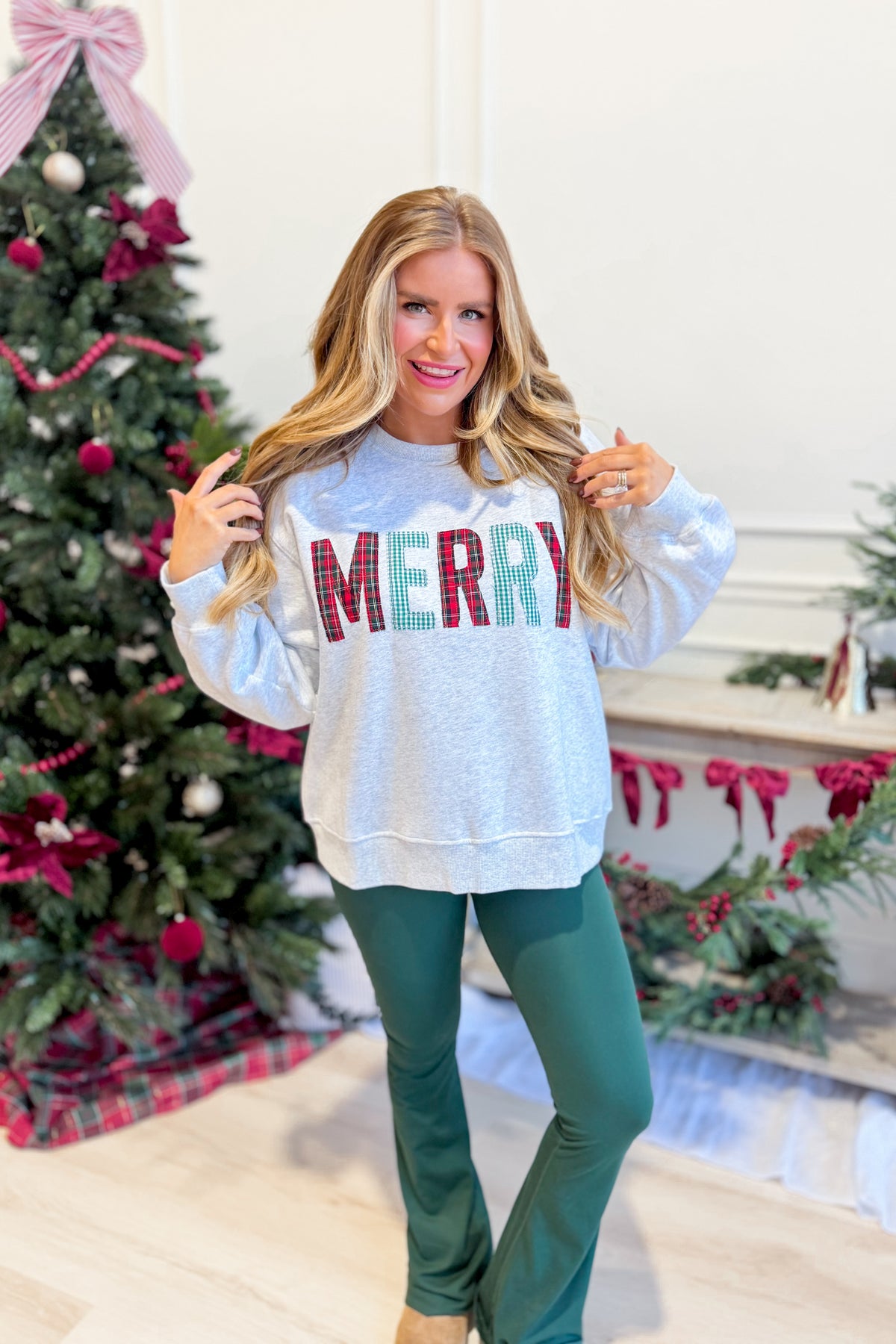 Everleigh Merry multi-colored graphic sweatshirt by TWENTIFOURTH, featuring vibrant design and cozy pullover style.