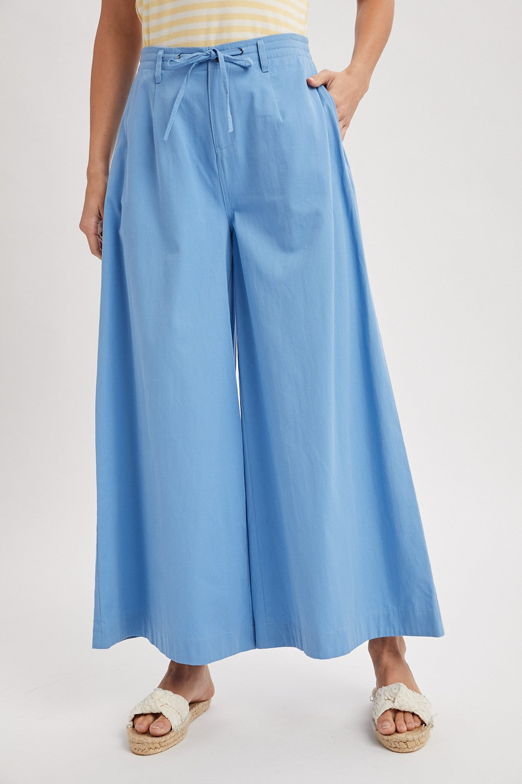 WISHLIST Reese wide-leg drawstring pants in a relaxed fit, featuring a comfortable waistband and flowing fabric.