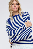 WISHLIST Haley striped drop shoulder spring sweater in pastel colors, featuring relaxed fit and cozy knit fabric.