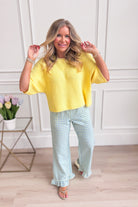 Candice Lemon knitted spring top from ENTRO, casual 105 top in soft yellow with a fitted, lightweight knit design.