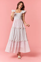 Peach Love Monica floral mixed pattern dress with long sleeves and a flowy silhouette, perfect for dressy occasions.