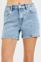 Risen Channing HR Raw Cut Denim Shorts in light blue with distressed details and frayed hem, styled on a model.