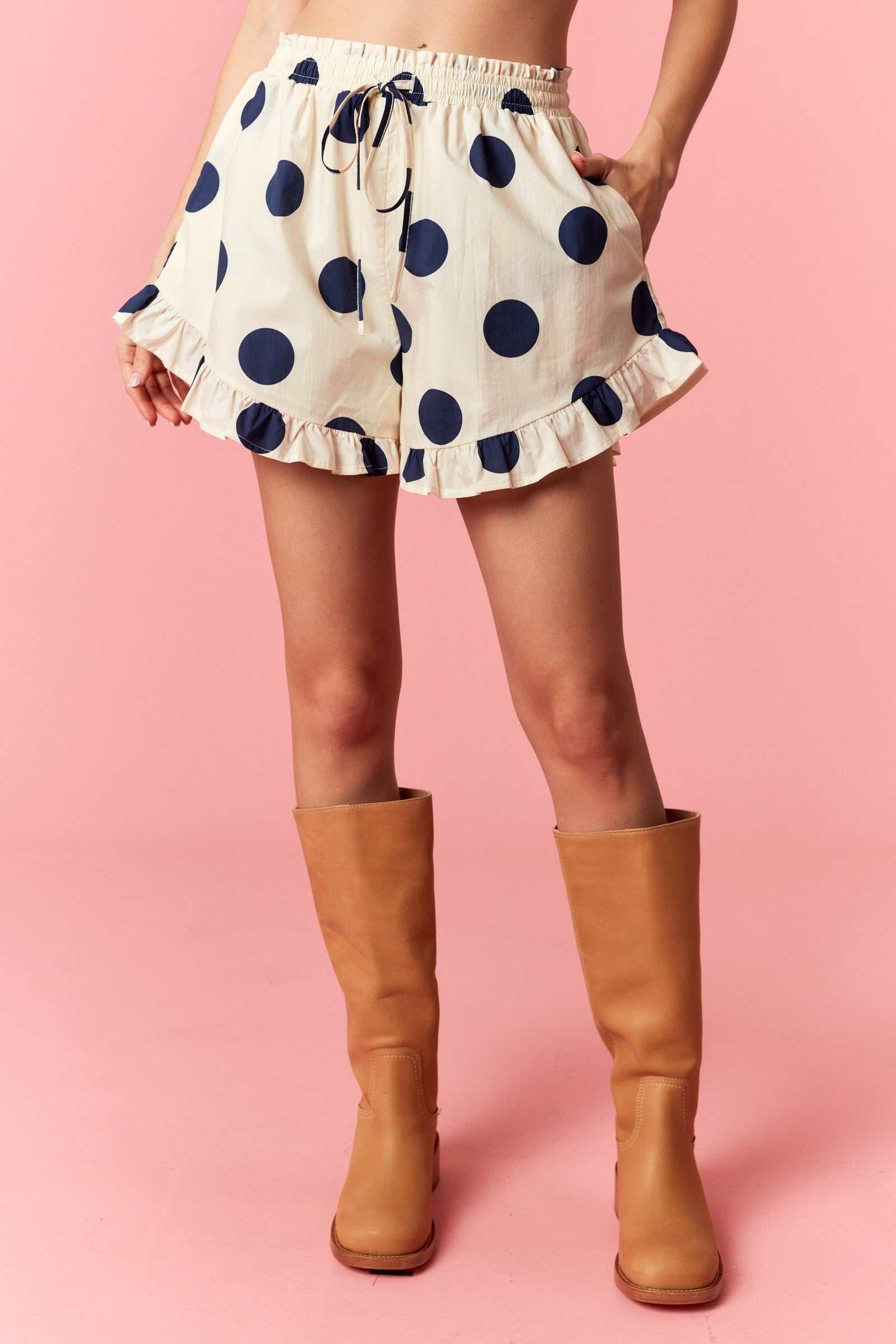 Lindsey navy polka dot ruffle trim short from PEACH LOVE, 152 shorts style, featuring ruffle details and polka dot pattern.