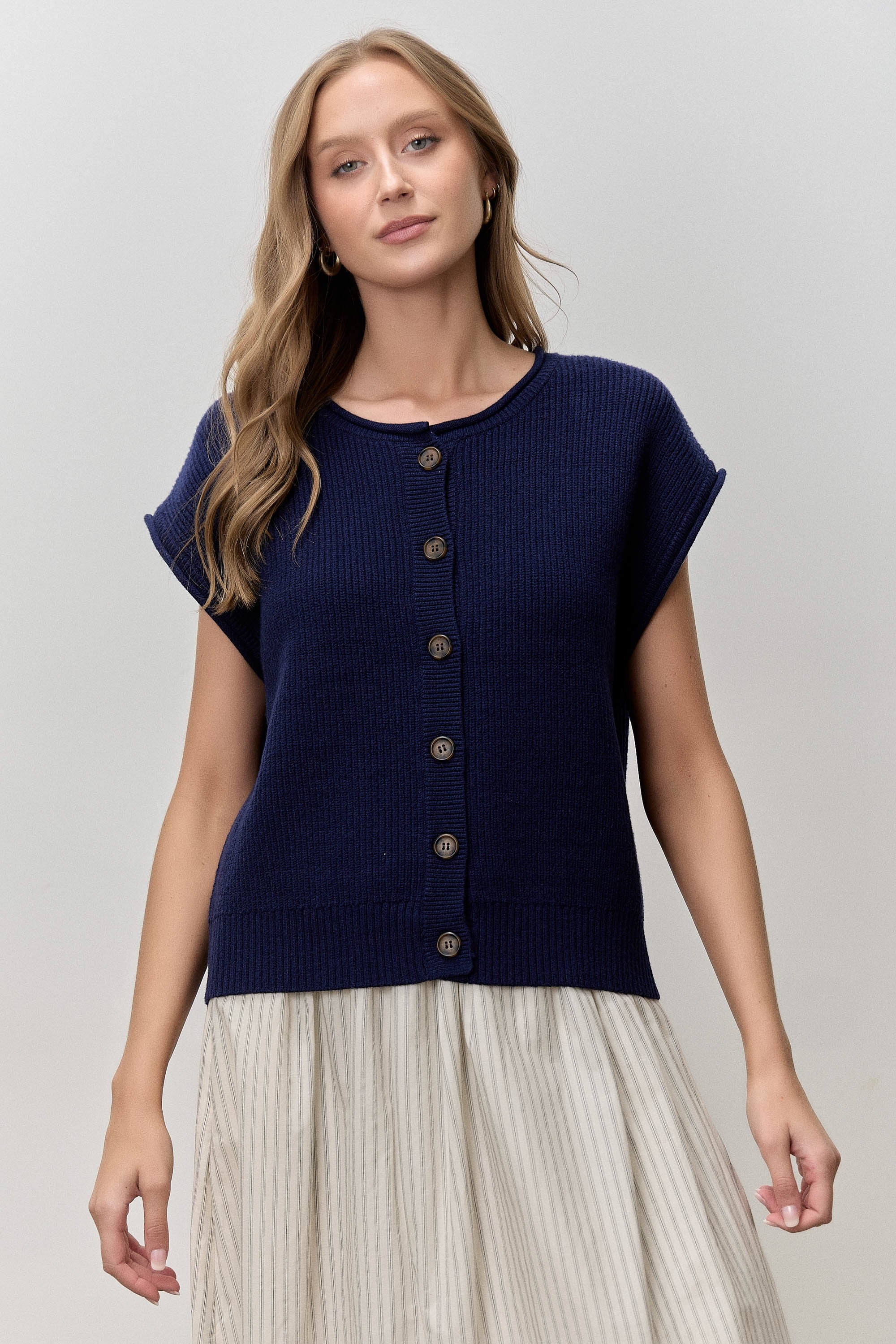 Noelle sleeveless button-up top by BAEVELY from 131 Spring Sweaters collection, shown in a close-up of the fabric and design.