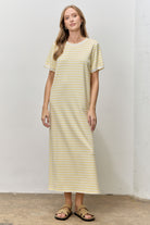 Baevely Piper Butter striped short sleeve midi dress with casual fit, featuring a relaxed style and colorful pattern.