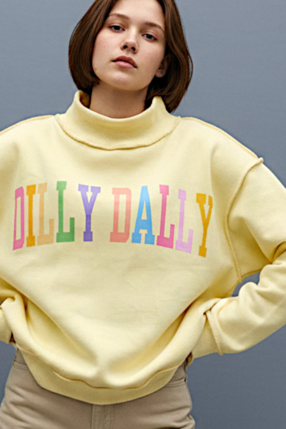 Colorful rainbow reversible mock neck sweatshirt from BUCKET LIST's 137 Graphic Sweatshirts collection, featuring bright rainbow designs.