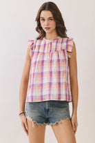 TCEC Ally plaid ruffle sleeve top featuring a plaid pattern and ruffled sleeves, perfect for dressy occasions.