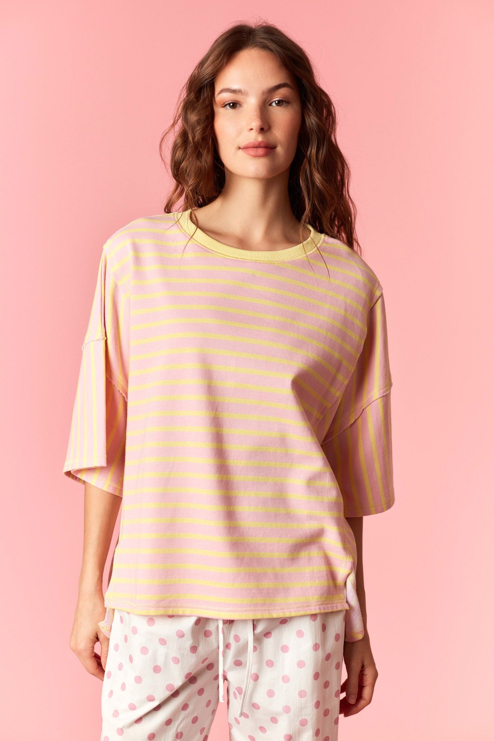 Peach Love Rudy striped relaxed casual top with long sleeves and a soft fabric, displayed on a hanger.